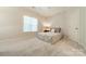Bright bedroom with carpet, large window, and neutral walls at 4599 Rustling Woods Dr, Denver, NC 28037