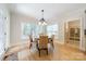Cozy dining area with hardwood floors, natural light, and a stylish chandelier at 4599 Rustling Woods Dr, Denver, NC 28037