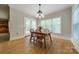 Cozy dining room features natural light, wood floors, and a view to the backyard at 4599 Rustling Woods Dr, Denver, NC 28037