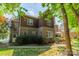 Exterior of a two-story brick home with landscaped yard and walkway at 4599 Rustling Woods Dr, Denver, NC 28037