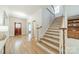 Inviting foyer with hardwood floors, staircase, and elegant details at 4599 Rustling Woods Dr, Denver, NC 28037