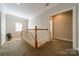 Upstairs hallway landing area offers natural light and access to other rooms on the second floor at 4599 Rustling Woods Dr, Denver, NC 28037