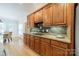 Modern kitchen with gas cooktop, tile backsplash, stainless steel appliances and wood cabinetry at 4599 Rustling Woods Dr, Denver, NC 28037