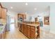 Open kitchen with stainless steel appliances, granite countertops, and wooden cabinets at 4599 Rustling Woods Dr, Denver, NC 28037