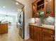 Kitchen area featuring wooden cabinets, granite countertops, and stainless steel appliances at 4599 Rustling Woods Dr, Denver, NC 28037