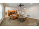 Open-concept living room seamlessly connected to the kitchen with a warm and inviting atmosphere at 4599 Rustling Woods Dr, Denver, NC 28037