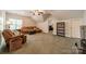 Comfortable living area with sloped ceilings and plush seating at 4599 Rustling Woods Dr, Denver, NC 28037