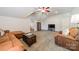 Open-plan living area featuring comfortable seating and storage options at 4599 Rustling Woods Dr, Denver, NC 28037