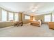 Spacious main bedroom featuring large windows and neutral decor at 4599 Rustling Woods Dr, Denver, NC 28037
