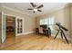 Bright office with hardwood floors, natural light, adjacent to dining room through glass french doors at 4599 Rustling Woods Dr, Denver, NC 28037
