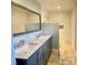 Modern bathroom with a double sink vanity and spacious subway tiled shower at 5119 Blackberry Ln, Matthews, NC 28104
