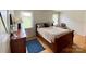 Charming bedroom with hardwood floors, natural light, and a comfortable bed with side tables, providing a relaxing atmosphere at 5119 Blackberry Ln, Matthews, NC 28104