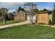 Exterior angle of a home with a garage, landscaping, and wooden fence at 5119 Blackberry Ln, Matthews, NC 28104