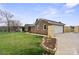 Brick home featuring a two-car garage, a new wooden fence, and well-maintained landscaping at 5119 Blackberry Ln, Matthews, NC 28104