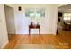 Bright foyer featuring wood floors and a decorative table beneath a window at 5119 Blackberry Ln, Matthews, NC 28104