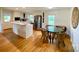 Bright kitchen with white cabinets, stainless steel appliances, and an island at 5119 Blackberry Ln, Matthews, NC 28104