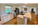 Kitchen with white cabinets, stainless appliances, and a central island at 5119 Blackberry Ln, Matthews, NC 28104