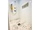 Walk-in shower featuring stylish tile work, dual shower heads, and a built-in niche at 5119 Blackberry Ln, Matthews, NC 28104