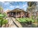 Back exterior of home showing large deck, patio, and a spacious backyard at 5125 Waxwind Ln, Charlotte, NC 28226