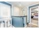 Modern bathroom featuring a glass-enclosed shower, white tile, and access to the primary bedroom at 5125 Waxwind Ln, Charlotte, NC 28226