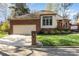 Charming brick home featuring a well manicured lawn and an attached two-car garage at 5125 Waxwind Ln, Charlotte, NC 28226