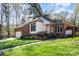 Charming brick home featuring a manicured lawn and an attached two-car garage at 5125 Waxwind Ln, Charlotte, NC 28226