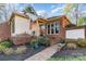 Charming brick home with a quaint front entrance and manicured landscaping at 5125 Waxwind Ln, Charlotte, NC 28226