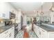 Modern kitchen features stainless steel appliances, and white cabinetry at 5125 Waxwind Ln, Charlotte, NC 28226