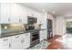 Modern kitchen features stainless steel appliances, a gas range, and stylish backsplash at 5125 Waxwind Ln, Charlotte, NC 28226