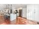 Bright kitchen with stainless steel appliances and an island with bar seating at 5125 Waxwind Ln, Charlotte, NC 28226