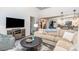Spacious living room features a large TV and open access to kitchen and foyer at 5125 Waxwind Ln, Charlotte, NC 28226