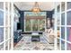 Comfortable living room with a large window, stylish decor, and ample natural light at 5125 Waxwind Ln, Charlotte, NC 28226