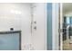 Close-up of a modern glass shower with white tile and multiple shower heads at 5125 Waxwind Ln, Charlotte, NC 28226