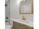 Bathroom with modern fixtures, a new vanity, gold faucet, and a shower with marble tiling at 530 S Trenton St, Gastonia, NC 28052