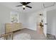 Bright bedroom features new floors, a ceiling fan, and a window providing ample natural light at 530 S Trenton St, Gastonia, NC 28052