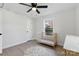 Cozy bedroom with ceiling fan, new floors, and natural light streaming through the window at 530 S Trenton St, Gastonia, NC 28052