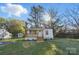 Charming single-story home featuring a cozy front porch, a well-manicured lawn, and mature trees at 530 S Trenton St, Gastonia, NC 28052