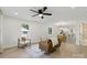 Bright living room with wood floors, neutral decor, and comfortable seating arrangement at 530 S Trenton St, Gastonia, NC 28052