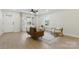 Bright living room with wood floors, neutral decor, comfortable seating, and natural lighting at 530 S Trenton St, Gastonia, NC 28052