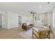 Bright living room with wood floors, neutral decor, comfortable seating, and natural lighting at 530 S Trenton St, Gastonia, NC 28052