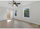 Spacious main bedroom with new flooring, natural light, and an ensuite bathroom at 530 S Trenton St, Gastonia, NC 28052
