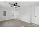 Large main bedroom with new floors, ceiling fan, and access to the ensuite bathroom at 530 S Trenton St, Gastonia, NC 28052