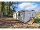 Back exterior view of a bright, cozy home featuring a yard and simple architectural details at 530 S Trenton St, Gastonia, NC 28052