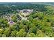 Aerial view of a neighborhood, showcasing homes and shopping areas, reflecting a convenient community at 5510 Sardis Rd, Charlotte, NC 28270