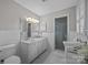 Elegant bathroom with a double vanity, marble countertops, tiled floors, and a glass-enclosed shower at 5510 Sardis Rd, Charlotte, NC 28270