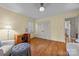 Bedroom with hardwood floors, natural light, and white and blue furniture at 5510 Sardis Rd, Charlotte, NC 28270