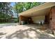 Large carport space with brick accents and ample storage, perfect for vehicles and outdoor activities at 5510 Sardis Rd, Charlotte, NC 28270