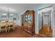 Charming dining area featuring an antique cabinet, brick floors, and easy access to other rooms at 5510 Sardis Rd, Charlotte, NC 28270