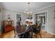 Formal dining room featuring hardwood floors, traditional furniture, and an elegant chandelier at 5510 Sardis Rd, Charlotte, NC 28270