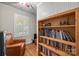 Comfortable office space with built-in bookshelves and a cozy chair, ideal for work and relaxation at 5510 Sardis Rd, Charlotte, NC 28270